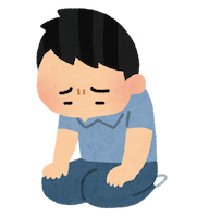 正座して反省している男性